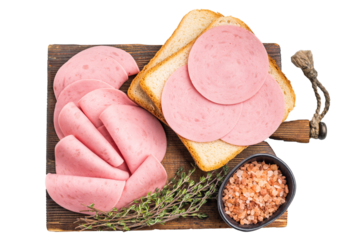Slices of bologna lunch meat on toasted bread with Himalayan salt and fresh thyme on a rustic wooden board. Simple food concept.