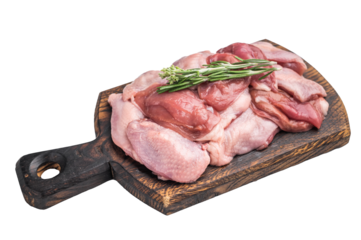 Raw quail breast fillets with rosemary on a rustic wooden cutting board, isolated on white. High-quality game meat.