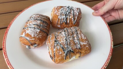 Serving a Plate of Chocolate Croissant Pastries