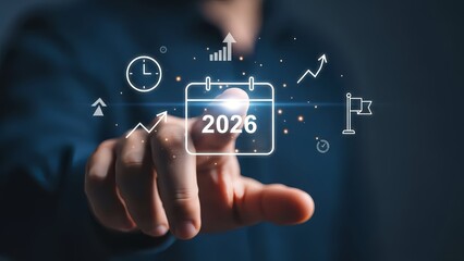 New Year 2026 Target: Hand Touching Glowing Screen with Corporate Growth Icons