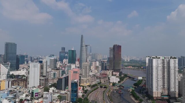 Aerial cityscape of Ho Chi Minh City showing dense buildings with Landmark 81 rising in the distance.