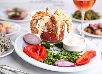 Mediterranean and Turkish meyhane cuisine with seafood, mezes, salads, grilled dishes, fresh fish, appetizers and desserts served in a modern restaurant setting.
