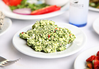 Mediterranean and Turkish meyhane cuisine with seafood, mezes, salads, grilled dishes, fresh fish, appetizers and desserts served in a modern restaurant setting.