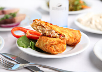 Mediterranean and Turkish meyhane cuisine with seafood, mezes, salads, grilled dishes, fresh fish, appetizers and desserts served in a modern restaurant setting.