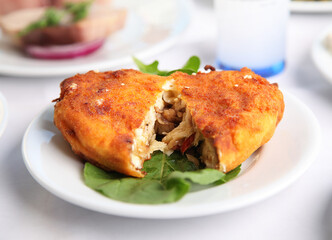Mediterranean and Turkish meyhane cuisine with seafood, mezes, salads, grilled dishes, fresh fish, appetizers and desserts served in a modern restaurant setting.