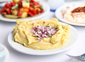 Mediterranean and Turkish meyhane cuisine with seafood, mezes, salads, grilled dishes, fresh fish, appetizers and desserts served in a modern restaurant setting.