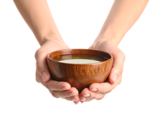 Two hands gently holding a small wooden bowl filled with clear, light-colored soup or broth, symbolizing comfort and warmth.