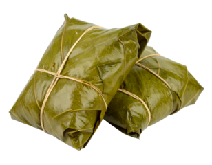 Two pieces of traditional Thai dessert or snack neatly wrapped in large, dark green leaves and secured with natural twine.