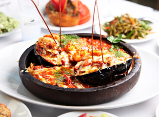 Mediterranean and Turkish meyhane cuisine with seafood, mezes, salads, grilled dishes, fresh fish, appetizers and desserts served in a modern restaurant setting.