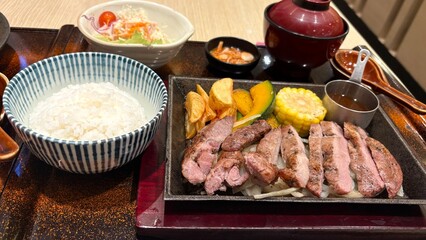 White rice and pieces of pork steak , japanese food photo.
