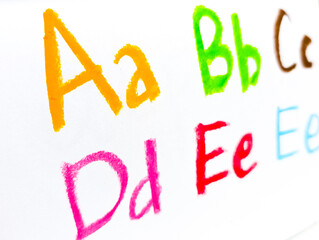 Crayon alphabet isolated over white background, Letters abcd. Colorful hand drawing crayon texture