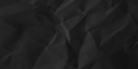 Black crumpled paper texture background. Abstract craft wrinkled kraft decorative pattern design. top view.