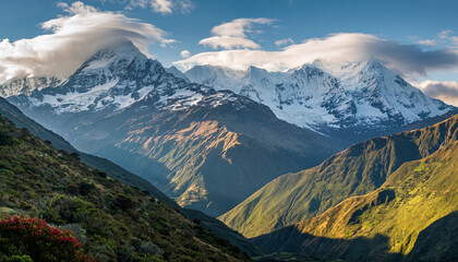 Majestic mountain range with snowcapped peaks under a bright sky. Lush, green valleys create a dramatic contrast. Inspiring for travel, adventure and nature themes.