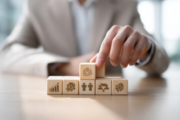 a close-up of hands in a business suit arranging wooden blocks with icons: growth, team, strategy, on a clean desk, soft natural light from window, modern office aesthetic