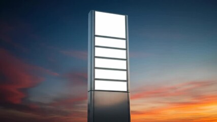 Illuminated urban sign with changing sky backdrop at sunset