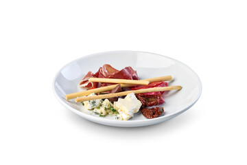 Charcuterie plate with prosciutto, cheese, breadsticks appetizer