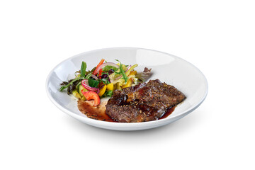 Grilled steak meal with fresh salad on white plate