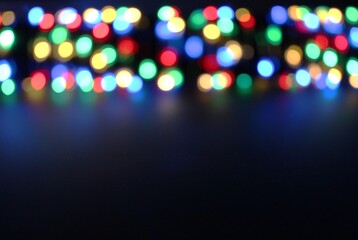 Long exposure light painting photography. Bokeh lights and black background with copy space