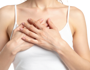 Woman scratching chest area showing skin irritation or allergy symptoms