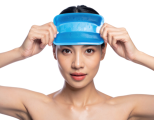 Woman holding blue silicone ice facial mask on forehead isolated