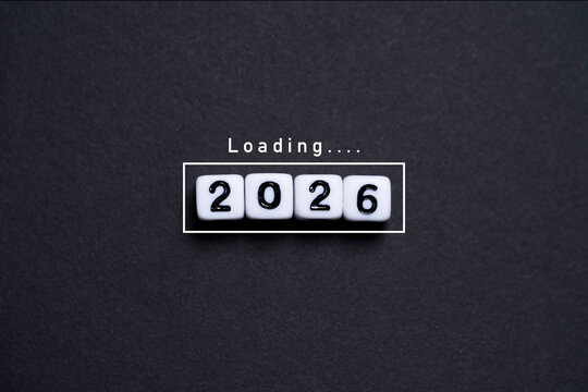 White number cubes forming 2026 with a loading text concept symbolize the upcoming new year future planning progress anticipation and preparation for goals and opportunities ahead.