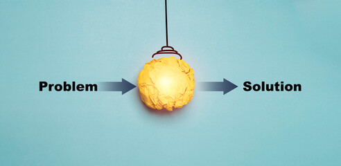 Creative concept showing the transition from problem to solution with a glowing yellow idea symbol representing innovation, brainstorming, business strategy and effective problem-solving process. © Dilok