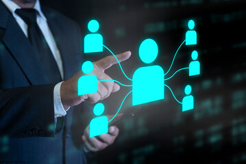 Hand touching network of people, representing social connections and digital communities, teamwork, global business, communication. Concept for business