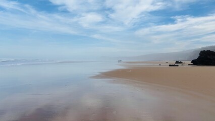 beach in the morning with beautiful clouds in the sky