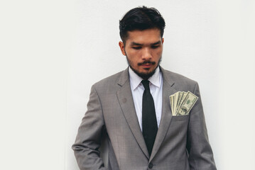 Backside Businessman spreading 100 dollar banknote in back jeans pocket. Hand holding loan money dollar bank note payment. Close up Man hands spread 100 dollar exchange cash. Bribe corruption concept