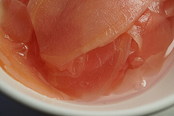 Closeup of Pickled Ginger with Sweet-Sour and Mild Spicy Flavor as a Food Condiment Side Dish