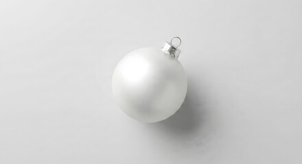 Matte white christmas bauble on light gray studio sweep