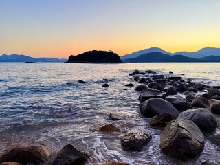 Sunset Beach and Rocky Shore on Sharp Island in Sai Kung, Hong Kong Viewed Toward the Mountains