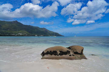 View of the picturesque tropical Beau Vallon Beach in Mahe, Seychelles, on the Indian Ocean