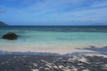 View of the picturesque tropical Beau Vallon Beach in Mahe, Seychelles, on the Indian Ocean