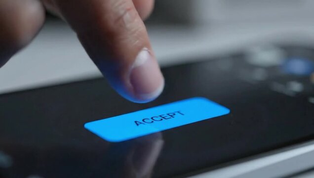 Finger pressing accept button on smartphone screen confirming digital agreement or transaction now