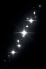 Naklejka premium A cascade of bright shimmering starbursts against a dark black background