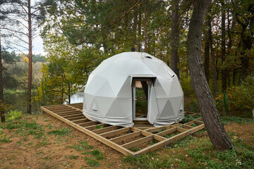 Geodesic domes for glamping and camping, thin-shell structure lattice shell based on geodesic polyhedron. Glamping is glamorous and camping, style of camping with amenities and resort style services.