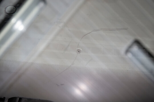 Repair of chips and cracks on car windows. Repair of windshields