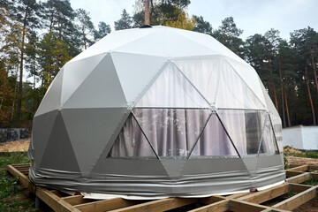 Geodesic domes for glamping and camping, thin-shell structure lattice shell based on geodesic polyhedron. Glamping is glamorous and camping, style of camping with amenities and resort style services.