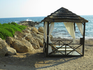 Beautiful landskape, palm trees and sun loungers at luxury resort