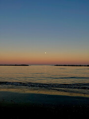 Calm Evening Sea with Soft Gradient Sky and Moon