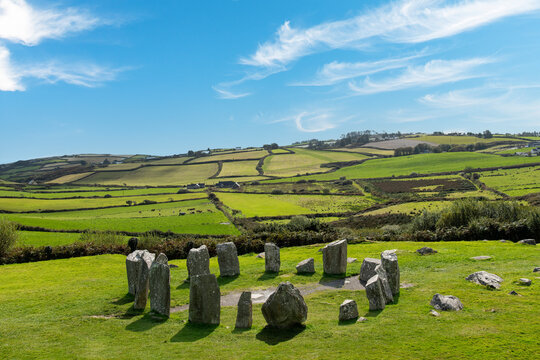 High angle view of the small axial Drombeg stone circle or The Druid's Altar at Drombeg, Glandore, Cork, Ireland with 13 stones in megalithic ruins have panoramic landscape in background