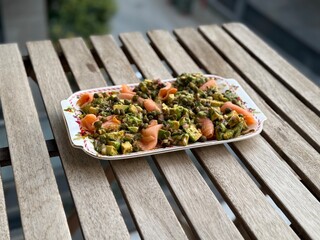 Salad with smoked salmon, avocado, and green leaves. Ideal healthy lunch or dinner concept