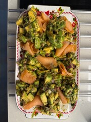 Salad with smoked salmon, avocado, and green leaves. Ideal healthy lunch or dinner concept