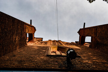 Red brick building with arches and windows captured from a dramatic low angle