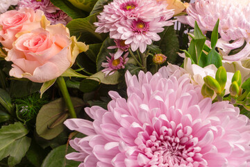 Bouquet of beautiful flowers with pink roses, brassica flower, chrysanthemum and freesia flower.