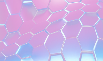 Abstract vibrant pink and blue glowing hexagonal grid surface