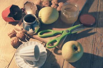 Wooden table with various objects and fruit, domestic life