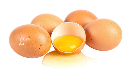 Pile of speckled brown chicken eggs with one cracked revealing golden yolk against a dark isolated background