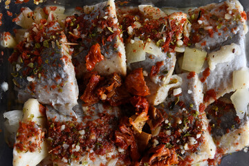 Herring with dried tomatoes and onion